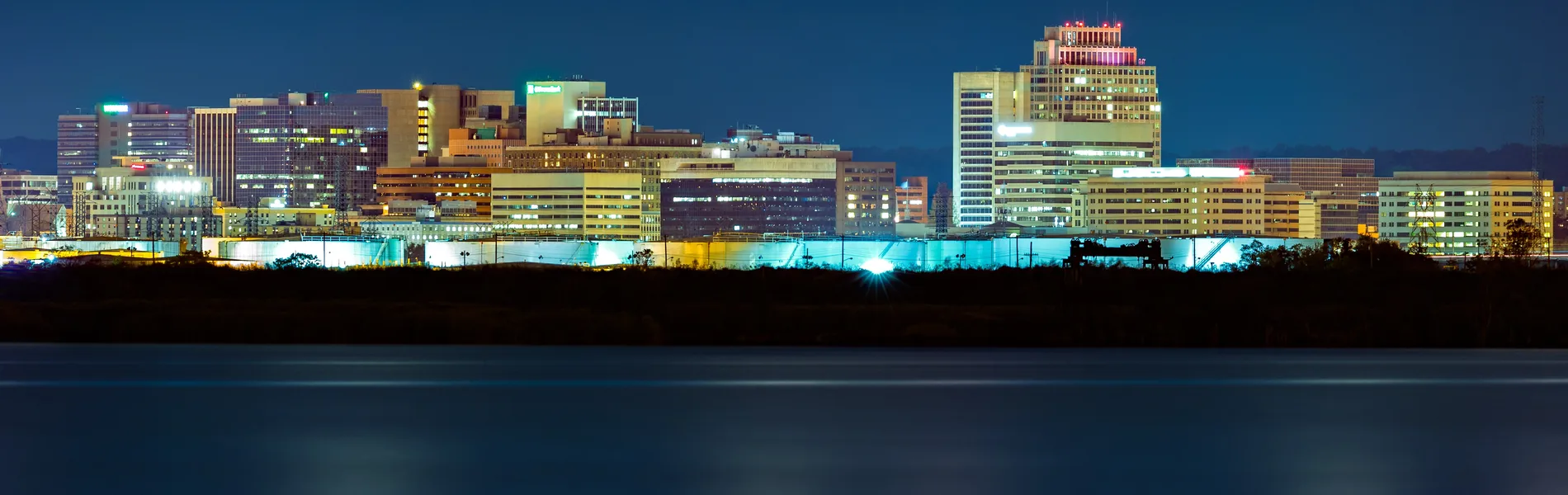 Neon color image of a band playing and people singing along